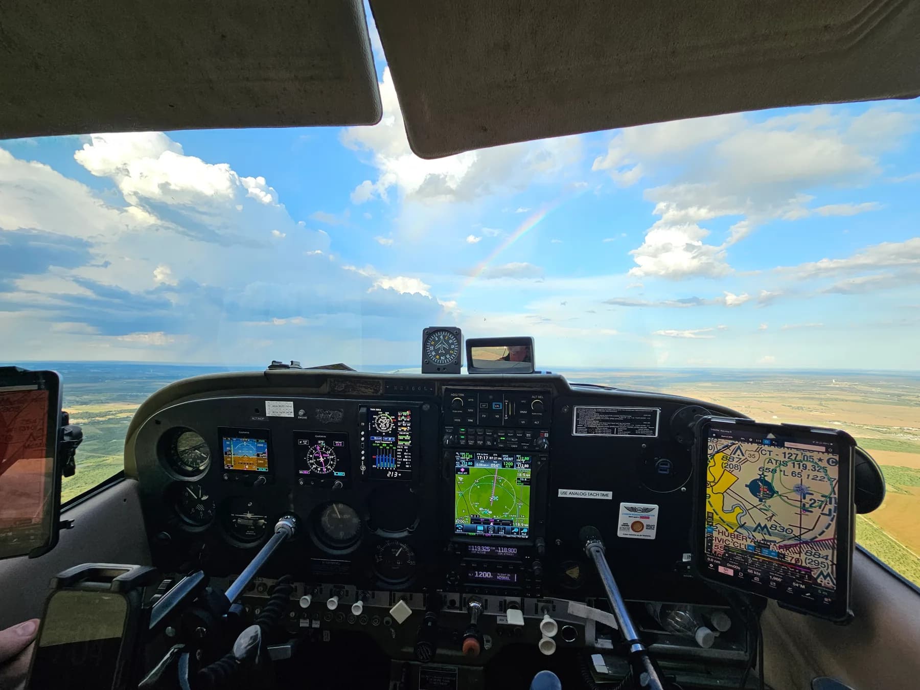 Glass cockpit of Chapman Flight Academy's TAA-equipped Cessna 172H, showing dual Garmin G5 displays and the Garmin GTN-750 in flight over Texas